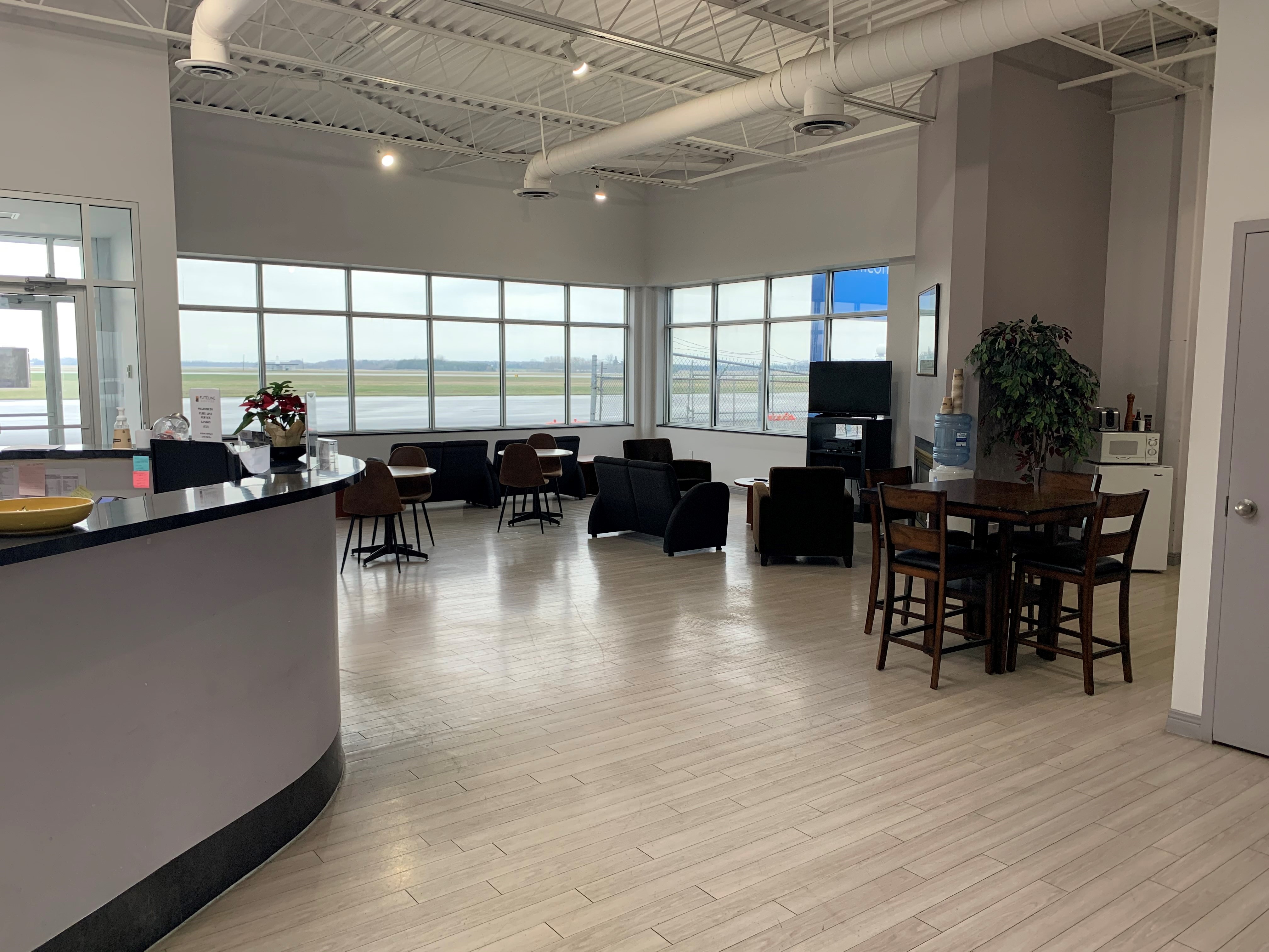 FBO passenger lounge at YXU London International Airport with comfortable seating and amenities